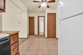 A kitchen with a refrigerator on the right side. at Windsor Crest Apartments, Davenport
